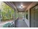 Inviting front porch featuring wood decking and views of the yard at 12 Woodland St, Dallas, GA 30157