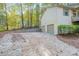 A home featuring a spacious two-car garage and a large parking pad at 12 Woodland St, Dallas, GA 30157