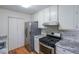 Modern kitchen featuring white cabinets and stainless steel appliances at 12 Woodland St, Dallas, GA 30157