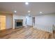 Cozy living room featuring vinyl floors and a stone fireplace at 12 Woodland St, Dallas, GA 30157