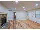 Bright living room with vinyl floors and stone fireplace at 12 Woodland St, Dallas, GA 30157