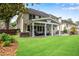Beautiful backyard with patio, outdoor seating area, and well-maintained lawn at 2500 Madison Commons, Atlanta, GA 30360