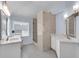 Bathroom showcasing double vanity with marble countertops, custom mirrors, and walk-in shower at 2500 Madison Commons, Atlanta, GA 30360