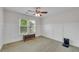 Spacious bedroom with natural light featuring white trim and a vintage chest at 2500 Madison Commons, Atlanta, GA 30360