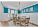 Bright dining room featuring large bay window and a chandelier at 2500 Madison Commons, Atlanta, GA 30360