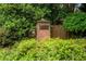 Community entrance to Madison subdivision with brick sign surrounded by mature landscaping at 2500 Madison Commons, Atlanta, GA 30360