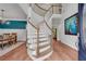 Elegant foyer with a winding staircase, hardwood floors, and stylish decor at 2500 Madison Commons, Atlanta, GA 30360