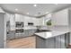 Modern kitchen with stainless steel appliances, quartz countertops, and ample cabinet space at 2500 Madison Commons, Atlanta, GA 30360