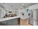 Spacious kitchen open to living area, complete with stainless appliances and a wine fridge at 2500 Madison Commons, Atlanta, GA 30360