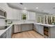 Well-lit kitchen featuring stainless steel appliances, white cabinets, and a wine cooler at 2500 Madison Commons, Atlanta, GA 30360
