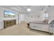 Bright main bedroom with decorative ceiling, dresser, and a sitting area at 2500 Madison Commons, Atlanta, GA 30360