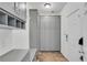 Well-organized mud room with built-in cabinets and bench for storage at 2500 Madison Commons, Atlanta, GA 30360