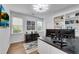 Bright office space features custom built-ins, hardwood floors, and a modern ceiling light fixture at 2500 Madison Commons, Atlanta, GA 30360