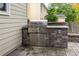 Built-in stainless steel grill on a stone base, perfect for outdoor entertaining at 2500 Madison Commons, Atlanta, GA 30360