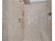Modern shower with herringbone tile, rainfall shower head, handheld sprayer and built-in shower bench at 2500 Madison Commons, Atlanta, GA 30360