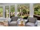Inviting sun room with large windows and backyard views at 2500 Madison Commons, Atlanta, GA 30360