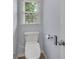 Bathroom toilet includes a bidet and electronic panel near the window and toilet paper holder at 2500 Madison Commons, Atlanta, GA 30360