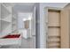 Well-organized walk-in closet with drawers, shelving and a full length mirror and access to the bathroom at 2500 Madison Commons, Atlanta, GA 30360
