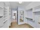 Spacious walk-in closet with a mirror, and shelving units and access to the bathroom at 2500 Madison Commons, Atlanta, GA 30360