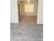 Cozy living room featuring plush carpeting, a bright window, and neutral paint at 4274 Carrollwood Dr, Stone Mountain, GA 30083