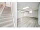 Spacious basement with vinyl floors, offering ample room for recreation and additional living space at 5141 Rocky Run, Stone Mountain, GA 30088