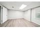 Unfinished basement with durable vinyl flooring, providing a blank canvas for customization and expansion at 5141 Rocky Run, Stone Mountain, GA 30088