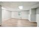 Versatile basement with durable vinyl flooring and a bright window, ready for customization and comfort at 5141 Rocky Run, Stone Mountain, GA 30088