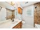 Bathroom featuring tile flooring, a large mirror, and granite countertops, exuding traditional style and functionality at 5141 Rocky Run, Stone Mountain, GA 30088