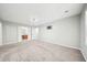 Large bedroom with carpet and neutral wall, has a large closet area and adjacent bathroom at 5141 Rocky Run, Stone Mountain, GA 30088
