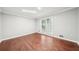 Neutral bedroom with hardwood floors and natural light from the window at 5141 Rocky Run, Stone Mountain, GA 30088