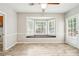 Well-lit breakfast nook featuring a bay window, wood-look flooring and access to the outdoors at 5141 Rocky Run, Stone Mountain, GA 30088