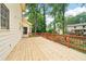 Expansive wood deck perfect for entertaining, with views of the surrounding greenery and neighborhood at 5141 Rocky Run, Stone Mountain, GA 30088