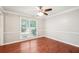 Bright dining room with hardwood floors, crown molding, and large window at 5141 Rocky Run, Stone Mountain, GA 30088