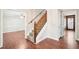 Inviting foyer with hardwood floors, carpeted stairs, and natural light at 5141 Rocky Run, Stone Mountain, GA 30088