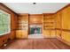 Open living room with hardwood floors, built-in shelving, and fireplace at 5141 Rocky Run, Stone Mountain, GA 30088