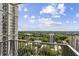 Balcony view overlooking lush trees and a city skyline, perfect for relaxing and enjoying the outdoors at 195 14Th Ne St # 1706, Atlanta, GA 30309