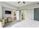 Cozy bedroom features plush carpeting, television, and ensuite bathroom with sliding door at 195 14Th Ne St # 1706, Atlanta, GA 30309