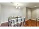 Minimalist dining space featuring a sleek table, modern chairs, and hardwood flooring at 195 14Th Ne St # 1706, Atlanta, GA 30309