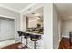Modern kitchen featuring bar seating, sleek countertops, and stylish white cabinetry at 195 14Th Ne St # 1706, Atlanta, GA 30309