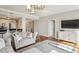Open-concept living space with modern furnishings flowing into the kitchen and dining areas at 195 14Th Ne St # 1706, Atlanta, GA 30309