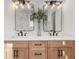 Double vanity bathroom with wood cabinets, white counters, and modern lighting at 2018 Presley Ne Way, Atlanta, GA 30317