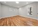 Bright bedroom with hardwood floors, two windows, and fresh paint at 2018 Presley Ne Way, Atlanta, GA 30317