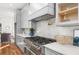 Modern kitchen featuring stainless steel appliances, gray cabinets, and a marble backsplash at 2018 Presley Ne Way, Atlanta, GA 30317