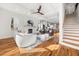 Bright living room featuring hardwood floors, a fireplace, white walls, and coffered ceilings at 2018 Presley Ne Way, Atlanta, GA 30317