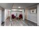 Finished basement featuring wood-like floors, neutral paint, and comfortable seating at 2668 Kings Way, Lawrenceville, GA 30044
