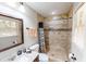 Bathroom with a tiled stand up shower, marble counter top and decorative shower curtain at 2668 Kings Way, Lawrenceville, GA 30044