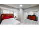 Bright bedroom features modern light fixtures, built-in closet, fresh paint, and hardwood flooring at 2668 Kings Way, Lawrenceville, GA 30044