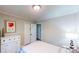 Bright bedroom featuring fresh paint, modern light fixture, and hardwood flooring at 2668 Kings Way, Lawrenceville, GA 30044