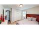 Comfortable bedroom with view to hallway, closet, fresh paint, and hardwood flooring at 2668 Kings Way, Lawrenceville, GA 30044