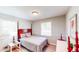 Well-lit bedroom features stylish bedframe, fresh paint, two windows for natural light at 2668 Kings Way, Lawrenceville, GA 30044